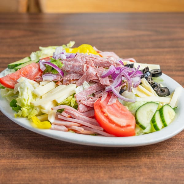 DeAngelo's Italian salad with salami, ham, cheese, tomatoes, cucumbers, olives, and red onion.
